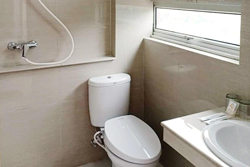 Twospaces Living At Maximus Inn Palembang Exterior photo